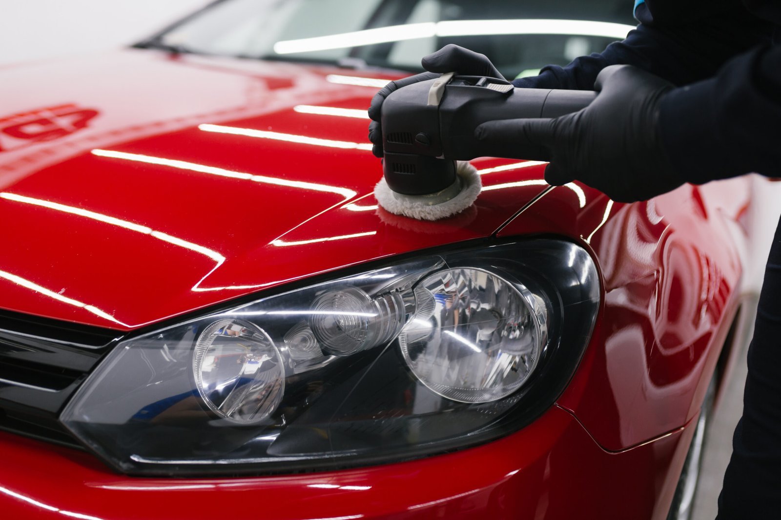 car-detailing-man-with-orbital-polisher-repair-shop-polishing-car-selective-focus-2-1-scaled-1.jpg